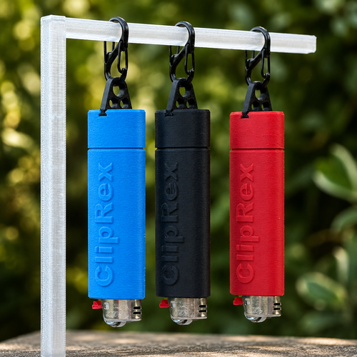 ClipRex lighter holders in blue, black and red, each clipped to a rail with a black carabiner and holding a full-size lighter